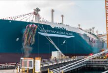A large ORLEN LNG carrier with spherical tanks transports natural gas at sea.