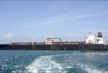An oil tanker navigates the Strait of Hormuz, a vital route for global crude shipments.