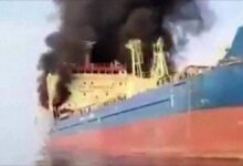 A commercial tanker navigates the Strait of Hormuz, highlighting maritime security concerns.