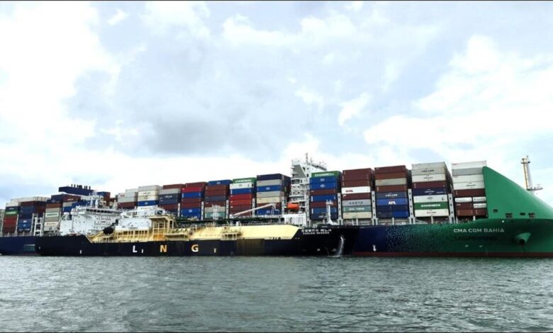 A FueLNG vessel conducts a ship-to-ship LNG bunkering operation in Singapore.