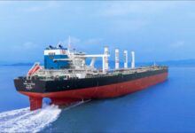 Bulk carrier sailing with multiple Anemoi rotor sails installed on deck.